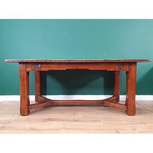 348 - A Knightsman style oak Refectory Table with carved edge, carving to the frieze Knight's head, etc, o... 