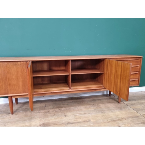 349 - A mid-century Danish teak Sideboard fitted three cupboard doors and four drawers on turned supports ... 