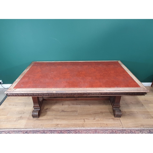 354 - A mahogany Library Table with inset writing surface, leafage carved frieze and raised on Renaissance... 