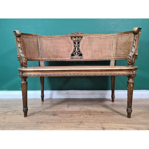 363 - A Louis XVI style Boudoir Settee with cane panelled back and seat, floral decoration on spiral legs