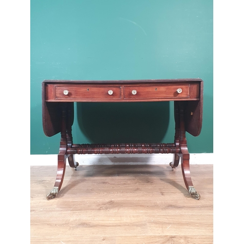 364 - A Regency mahogany Sofa Table in the manner of Gillows fitted two frieze drawers on twin turned colu... 