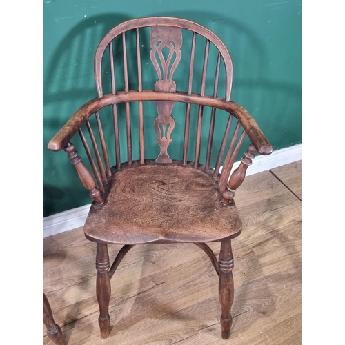 370 - A close matched pair of 19th Century yew and elm Windsor Elbow Chairs with pierced splat backs and c... 