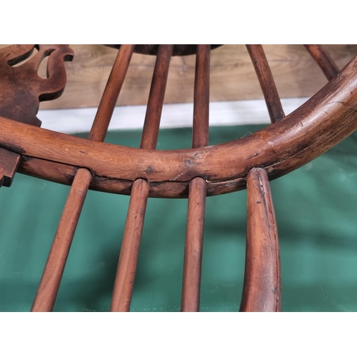 370 - A close matched pair of 19th Century yew and elm Windsor Elbow Chairs with pierced splat backs and c... 