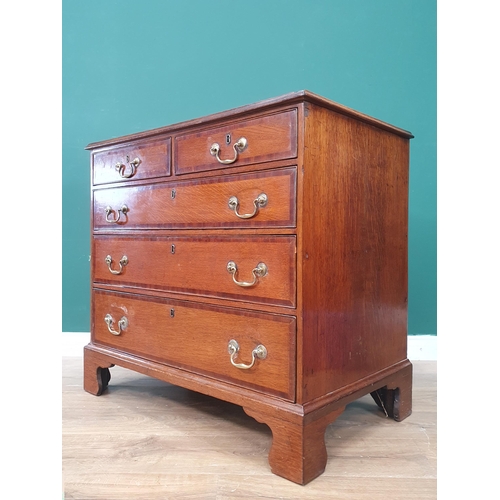 374 - A small 19th Century oak Chest of Drawers crossbanded in mahogany fitted two short and three long gr... 