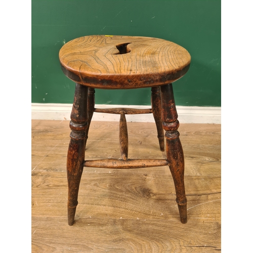 376 - An antique elm oval topped Stool on turned ash supports united by H-stretcher 1ft 8in x 1ft 3in W