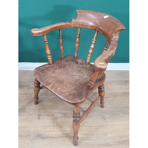 377 - A near pair of 19th Century ash and elm Smoker's Bow Elbow Chairs with turned spindle backs, one wit... 