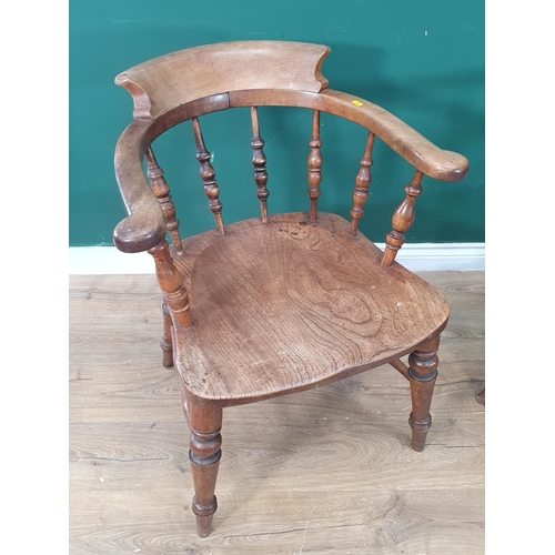 377 - A near pair of 19th Century ash and elm Smoker's Bow Elbow Chairs with turned spindle backs, one wit... 