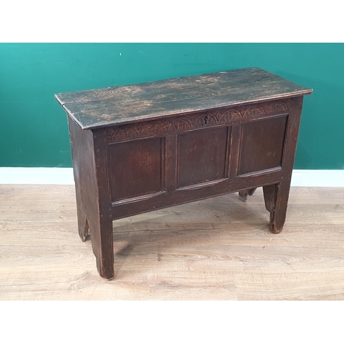 378 - A 17th Century oak Plank Coffer with arcaded frieze above a three panelled front and with original h... 