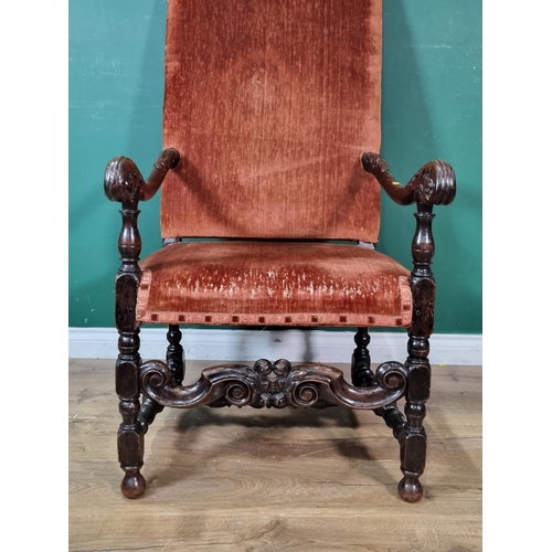 383 - A William and Mary walnut open Armchair with leafage carved scroll arms and red upholstery raised on... 