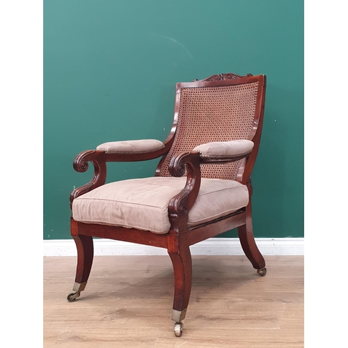 384 - A 19th Century mahogany framed Open Armchair, with carved scrolled top rail, sloping cane-work backr... 