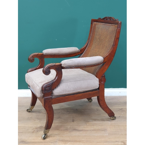 384 - A 19th Century mahogany framed Open Armchair, with carved scrolled top rail, sloping cane-work backr... 