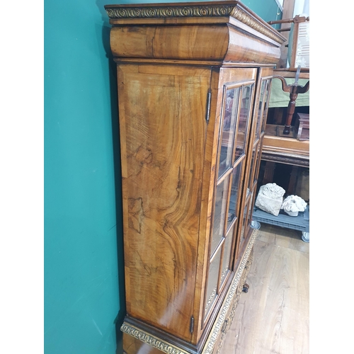 385 - A Queen Anne style carved walnut and gilt Cabinet on stand, the moulded cornice above and pair of gl... 