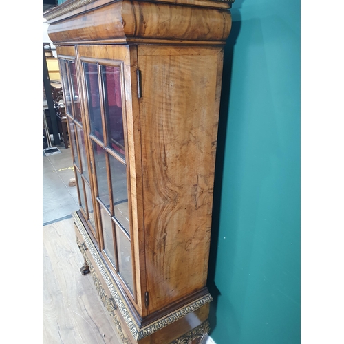 385 - A Queen Anne style carved walnut and gilt Cabinet on stand, the moulded cornice above and pair of gl... 