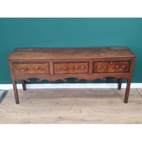 386 - A Georgian oak and crossbanded Dresser Base, fitted three drawers above a shaped frieze on squared s... 