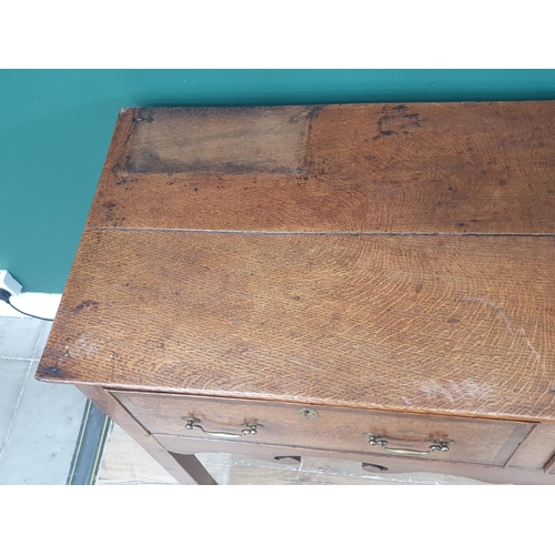 386 - A Georgian oak and crossbanded Dresser Base, fitted three drawers above a shaped frieze on squared s... 