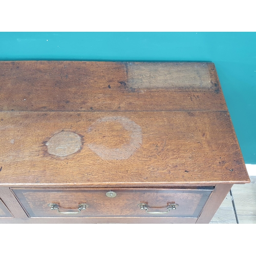 386 - A Georgian oak and crossbanded Dresser Base, fitted three drawers above a shaped frieze on squared s... 