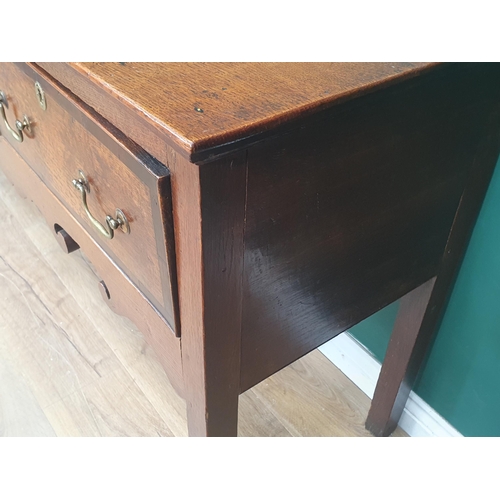 386 - A Georgian oak and crossbanded Dresser Base, fitted three drawers above a shaped frieze on squared s... 