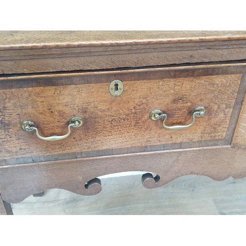 386 - A Georgian oak and crossbanded Dresser Base, fitted three drawers above a shaped frieze on squared s... 