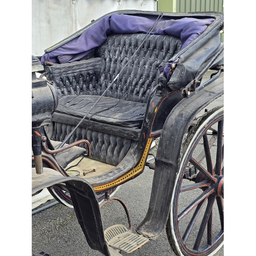 387 - A black painted Horsedrawn Carriage with leather canopy and gilt and red painted detail and button-u... 