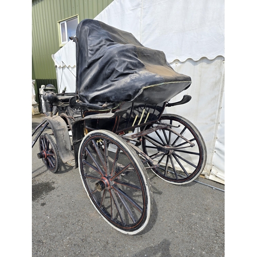 387 - A black painted Horsedrawn Carriage with leather canopy and gilt and red painted detail and button-u... 