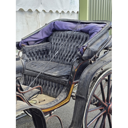 387 - A black painted Horsedrawn Carriage with leather canopy and gilt and red painted detail and button-u... 