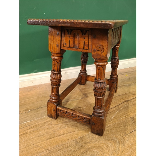 390 - An oak Joint Stool in the Elizabeth I manner,  the plank top with chip carved ends above nulled frie... 