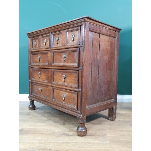 398 - A William and Mary oak Chest of two short, three long Drawers, with moulded drawer fronts, teardrop ... 