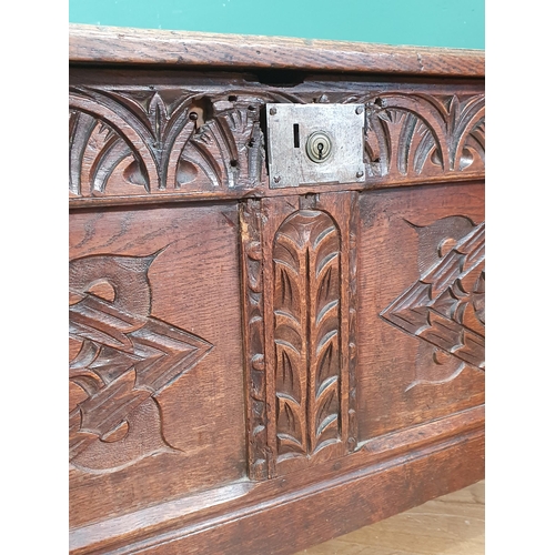 400 - A late 17th Century oak Coffer, with sunken three panel lid, above carved arched floral frieze, and ... 