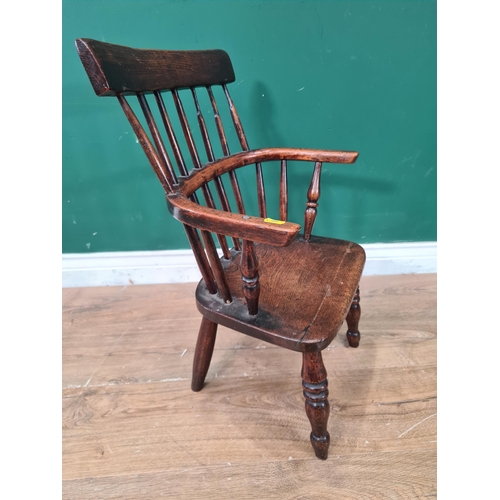 404 - A 19th Century ash child's stick back Elbow Chair with straight top rail 1ft 11in H