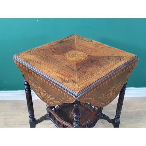 409 - An Edwardian rosewood Occasional Table with satin wood marquetry inlay having four folding flaps rai... 