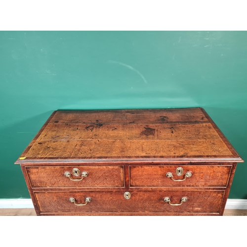 411 - A late Georgian oak Chest with cross-banded top above two short and three long drawers on bracket fe... 