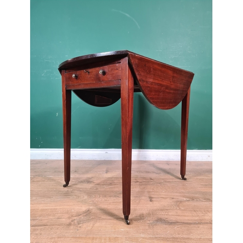 423 - A George III mahogany oval Pembroke Table fitted end drawer on square tapering legs and casters, 2ft... 