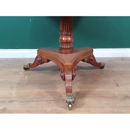 428 - A Regency mahogany circular Centre Table with brass inlaid top on turned and fluted column, concave ... 