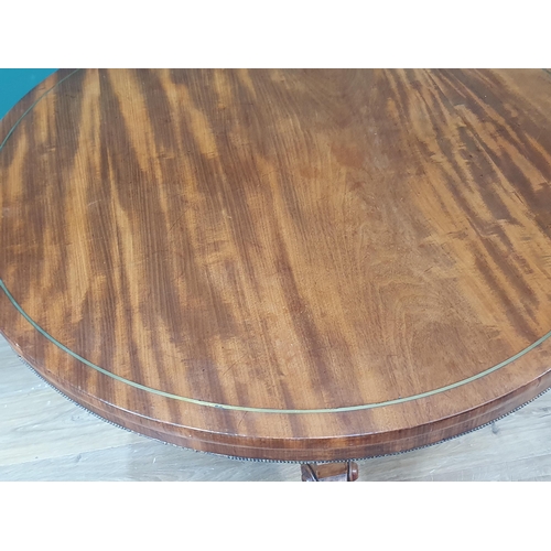 428 - A Regency mahogany circular Centre Table with brass inlaid top on turned and fluted column, concave ... 