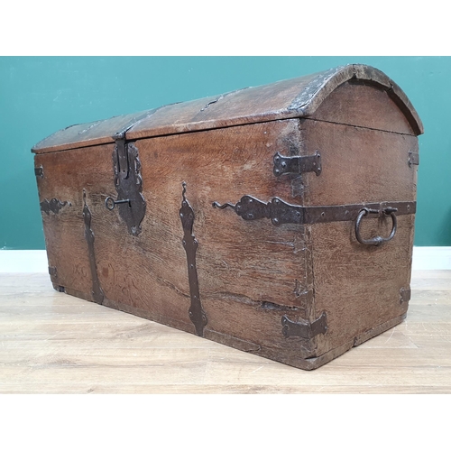 433 - A 17th Century iron bound dome lidded Chest and key, with interior candle box, decorative iron strap... 