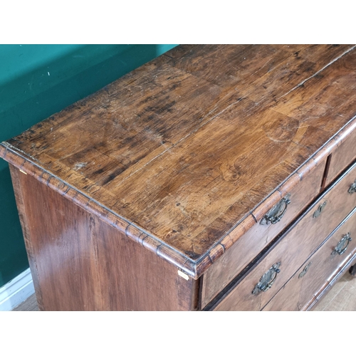 436 - An 18th Century walnut Chest of two short and two long drawers with moulded top raised on bracket fe... 