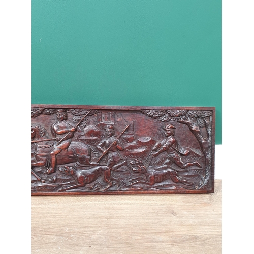 439 - A carved oak rectangular Panel depicting a 