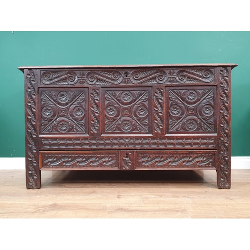 441 - An Antique and later carved oak Mule Chest, the lift up lid above carved leafage and scrolled frieze... 