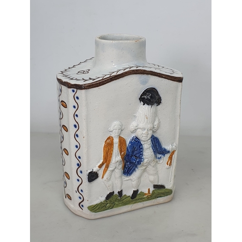 459 - A Prattware Tea Caddy with macaroni moulded figures with painted highlighted decoration (lacking cov... 