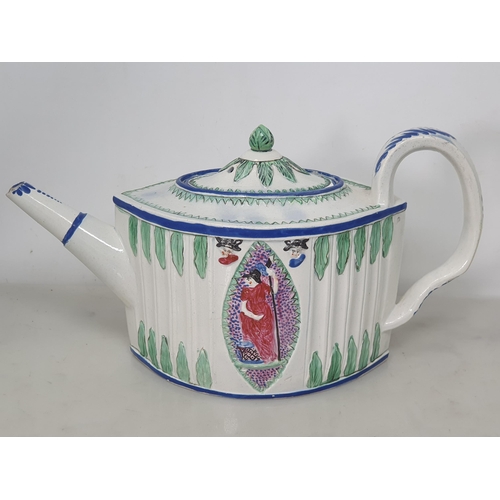 460 - A Teapot, the lid with bud finial, the body with two oval panels with moulded figure decorations wit... 