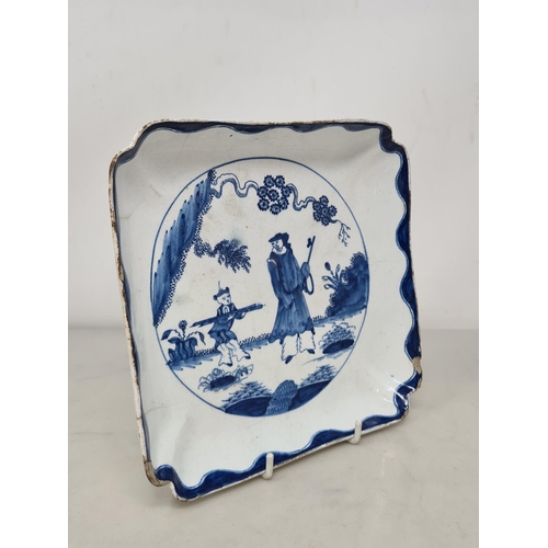 465 - An 18th Century bow porcelain 'Golfer and Caddy' pattern square Dish with shaped rim, and blue wavy ... 