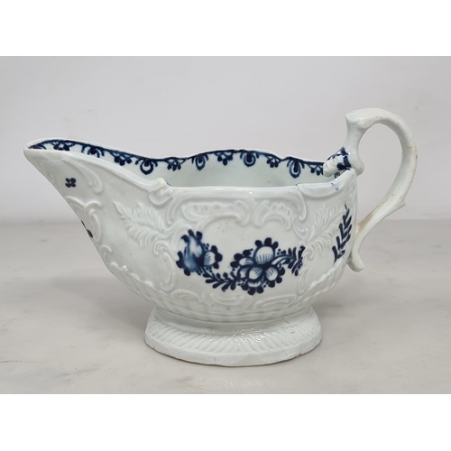 466 - A Liverpool c.1770 porcelain Sauceboat with shaped handle, moulded scrolled and leafage designs, wit... 