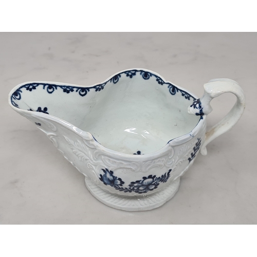 466 - A Liverpool c.1770 porcelain Sauceboat with shaped handle, moulded scrolled and leafage designs, wit... 