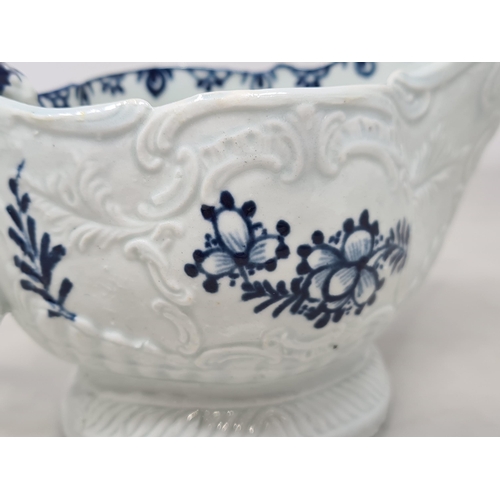 466 - A Liverpool c.1770 porcelain Sauceboat with shaped handle, moulded scrolled and leafage designs, wit... 