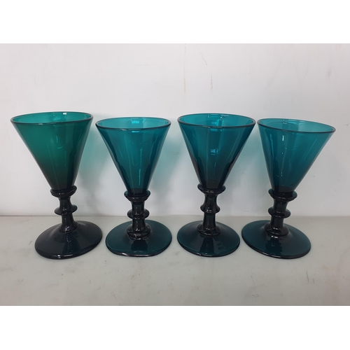 469 - Eight green glass Wine Glasses with conical bowls on single knop stems, 4 1/2in, one with ground rim