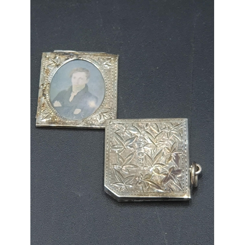 47 - An Edward VII silver Pendant leafage engraved, with vacant cartouche enclosing two oval portrait min... 