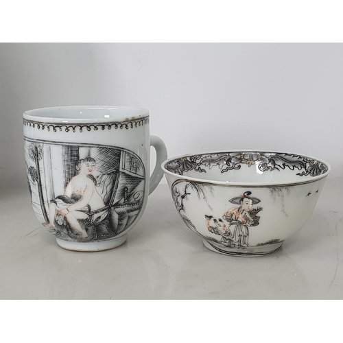 474 - A Chinese grisaille export Tea Bowl and Saucer with leafage borders with central scene of figures in... 