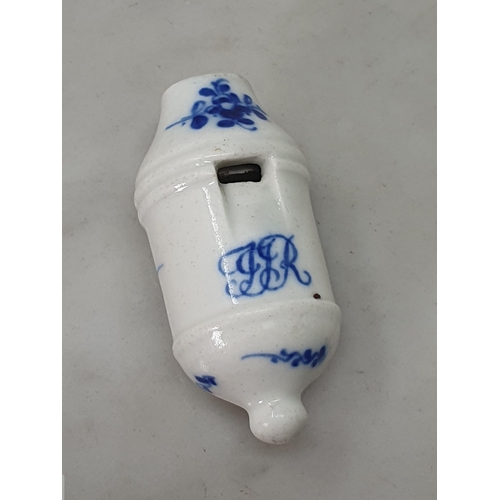 478 - An early 19th Century Blue & White Worcester Porcelain Whistle, decorated with floral swags and bear... 