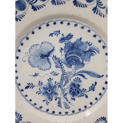 503 - An 18th Century blue and white Bowl/Charger with stylised border, the centre with floral designs and... 