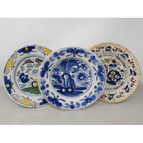 504 - A blue and white Delft Bowl with floral designs, 9in, two Delft Bowls with polychrome stylised flora... 